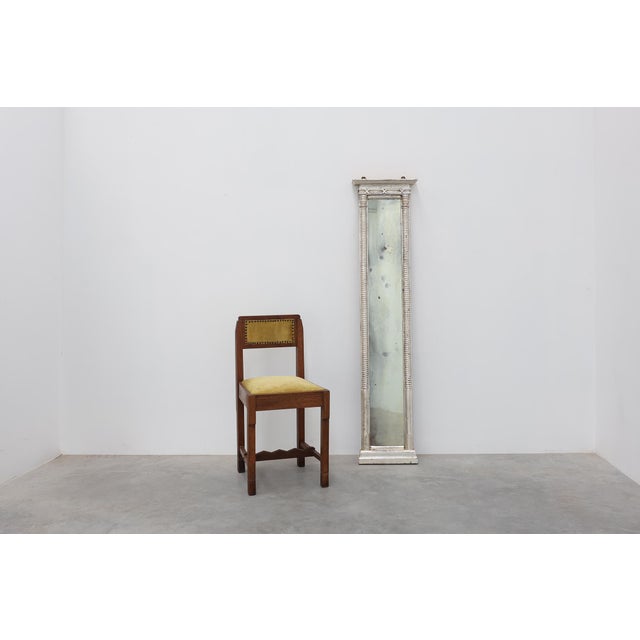 An elegant Italian neoclassical pier mirror dating to the mid-19th century, distinguished by its exceptionally tall and...