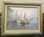 A maritime harbor scene featuring docked boats, tall ships masts, and a coastal/lighthouse structure rendered in muted,...