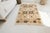 This is a vintage Turkish Oushak rug from the Mid 20th Century. The piece was hand-knotted.