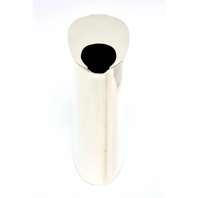 This substantial and signed sterling silver Mid-Century pitcher is fantastic. It has been professionally polished and...
