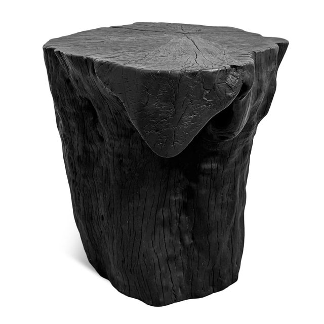 Solid lychee wood stump stool or side table. Attractive modern black finish subtly highlighting the natural wood grain....