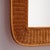 A handcrafted rattan mirror with organic shapes from the 1970s.