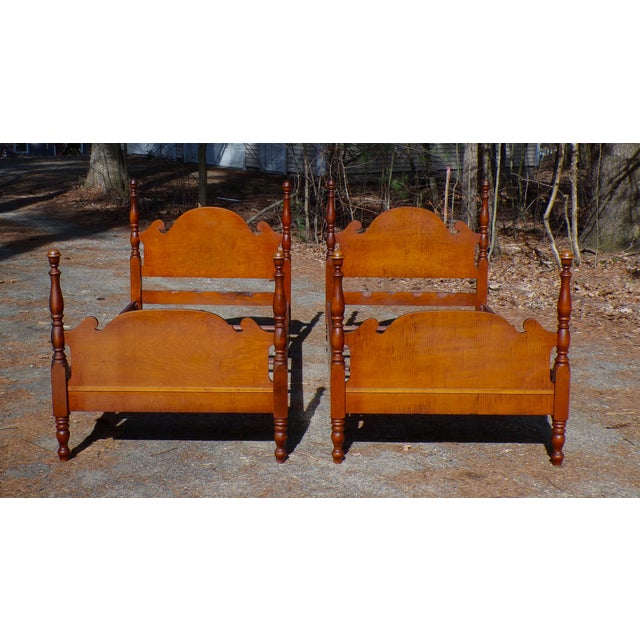 A Pair of Atlas Furniture poster twin size bed frames. The headboards and footboards have sculptural panels set between...