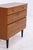 Vintage shoe cabinet from the 1960s with a practical layout and warm wood finish. Behind the two drop-down compartments is...