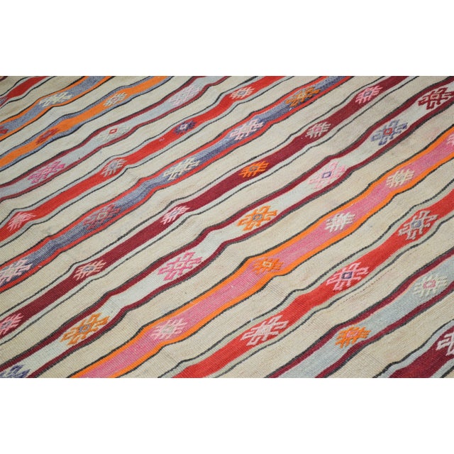 Vintage Turkish Anatolian hand woven kilim with natural colors and fine weave.