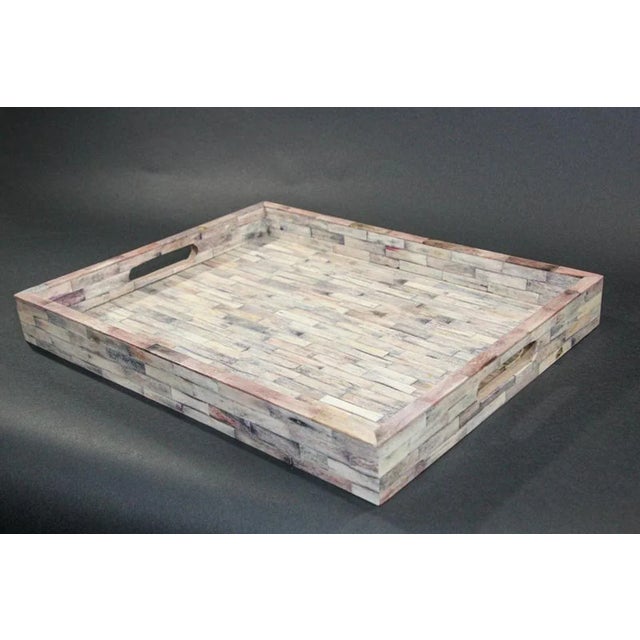 Large rectangular geometric patterned wood and white bone inlaid serving tray. Made of wood and then tessellated with...