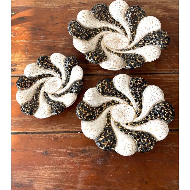 Mid-century set of ceramic bowls, beautifully detailed in 22k gold. Marked. Large: Medium: Small: