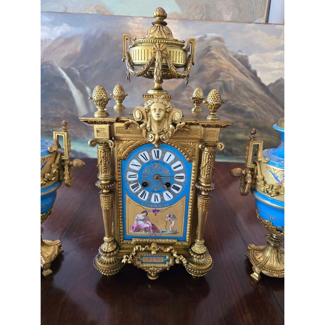 A true antique museum quality french porcelain and gilt bronze clock set attributed to sevres . A perfect matching set (...