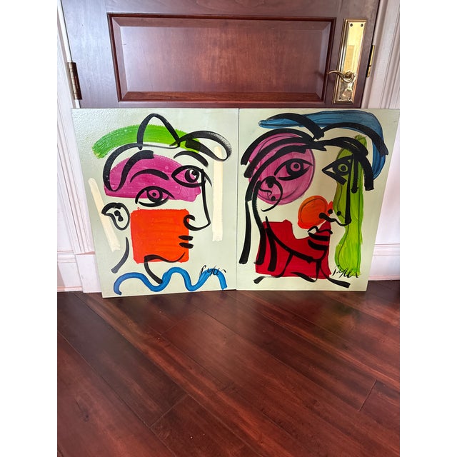 Fantastic pair of early paintings by Peter Keil. Each depicts a cubist abstract portrait on board. Signed P Keil. Coa on...
