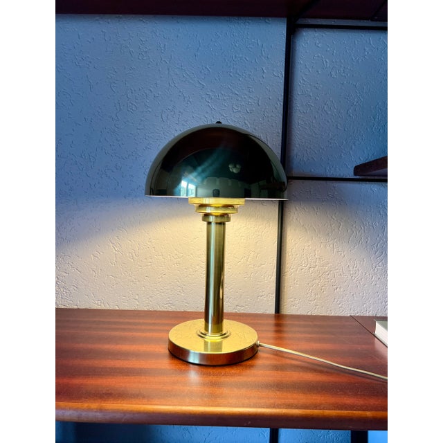 An absolute classic is this lamp from the 1970s from WSB in the Bauhaus style with a mushroom lampshade. The brass is in...