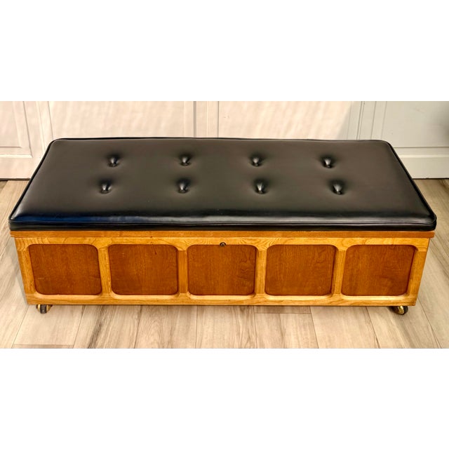 Here is a 1966 Lane cedar chest and upholstered storage bench, featuring a beautifully detailed oak exterior, contrasting...
