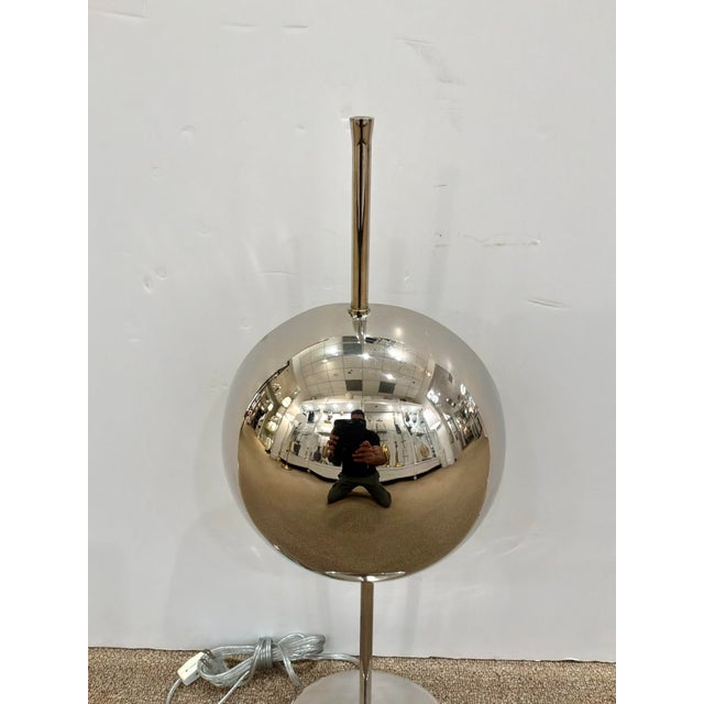 Modern Arteriors Wall Washer Lamp Polished Nickel. Round base with round front design, lights on back. Showroom floor sample.