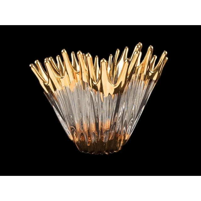 Mouth blown crystal glass bowl with great details in a flowing free form. The stylish bowl in a ridge and swirl design, is...