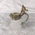 This is a, I think, a crystal pitcher (or milk jug, or creamer, or syrup pitcher) with a metal top that does not seem to...
