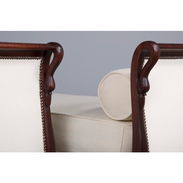 An exquisite pair of early 19th-century French Empire daybeds, sourced directly from Paris, France. Masterfully crafted...