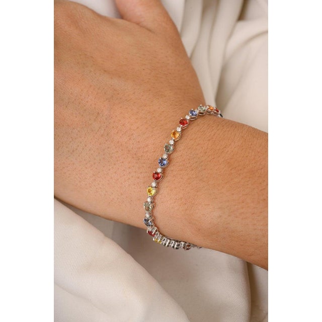 This is part of Chairish’s Fine Jewelry assortment. This 4.85 Carat Heart Cut Multi Sapphire Diamond Tennis Bracelet in...