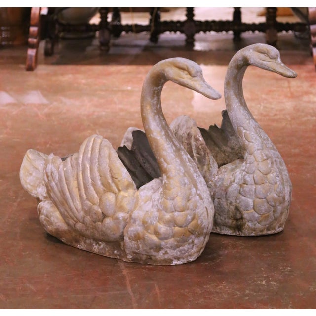 Decorate a garden, patio, or interior space with this striking pair of antique French swan planters, crafted circa 1950....