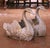Decorate a garden, patio, or interior space with this striking pair of antique French swan planters, crafted circa 1950....
