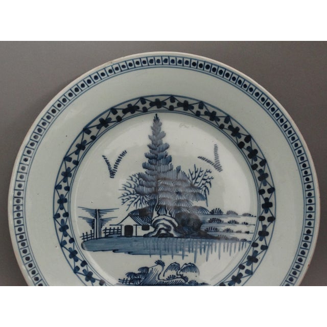 An 18th-Century English Delft charger. It is a fine quality charger, hand painted in cobalt blue and white with a...