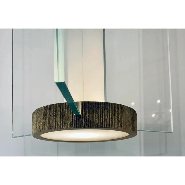 Original Retail $15,600, stylish Baker Modern Satin Brass Finished Glow Lantern, three glass panels, white stem, textured...