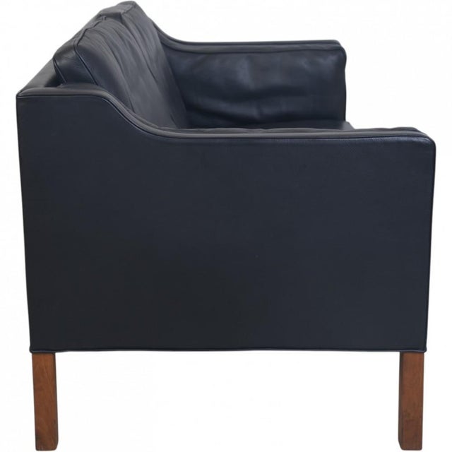 Børge Mogensen 2212 2.seater sofa upholstered in black leather and with legs of mahogany. The sofa is from the 1980s but...