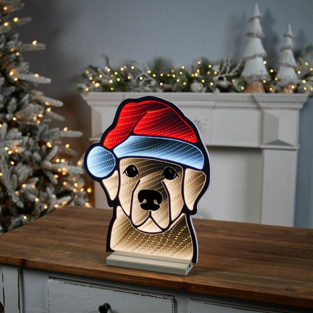 Add a playful and heartwarming touch to your holiday decor with the Festive Holiday Dog with Santa Hat  Ekkolight...