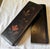 Gorgeous antique Japanese lacquerware glove box depicting a hand painted botanical scene. The box is long and light weight...