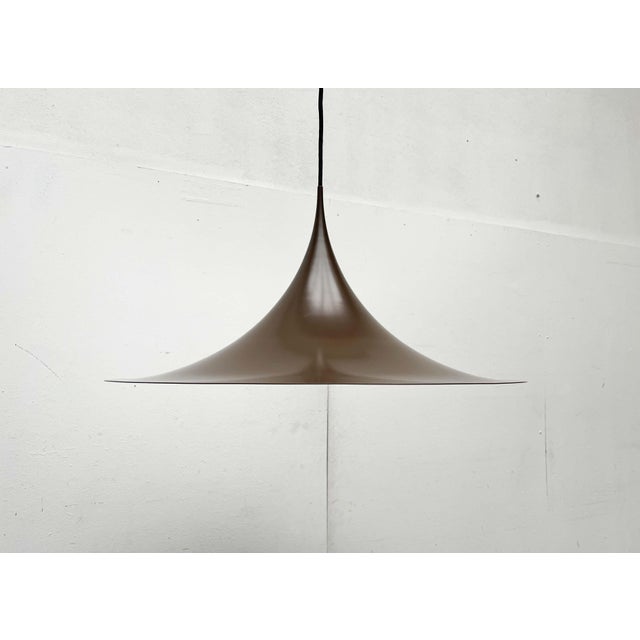 Original Semi pendant lamp by the Danish manufacturer Fog & Mørup. This is the rare brown version with a diameter of...