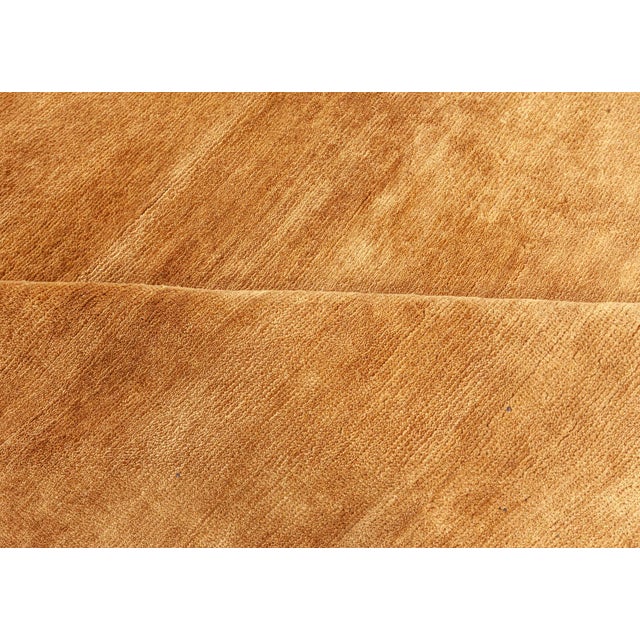 Contemporary hand-knotted wool rug in a rich shade of golden brown by Doris Leslie Blau Size: 9'5" × 15'4" (287 × 467 cm)...