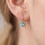 Elevate your style with the vibrant, crystal-clear radiance of vivid sky-blue. Designed with an elegant, minimalist drop...