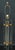 A modern John-Richard lamp. The lamp consists of 3 cylindrical lucite "wands" consolidated by 2 brass ring trios. A Fine...