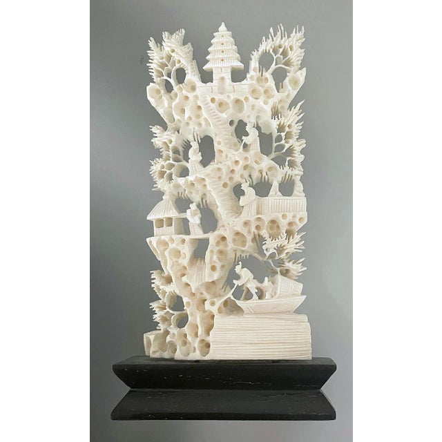 Carved Chinese Panel Village This piece measures just over 4.5" tall by 2" wide. Some chipping on the wood base finish,...