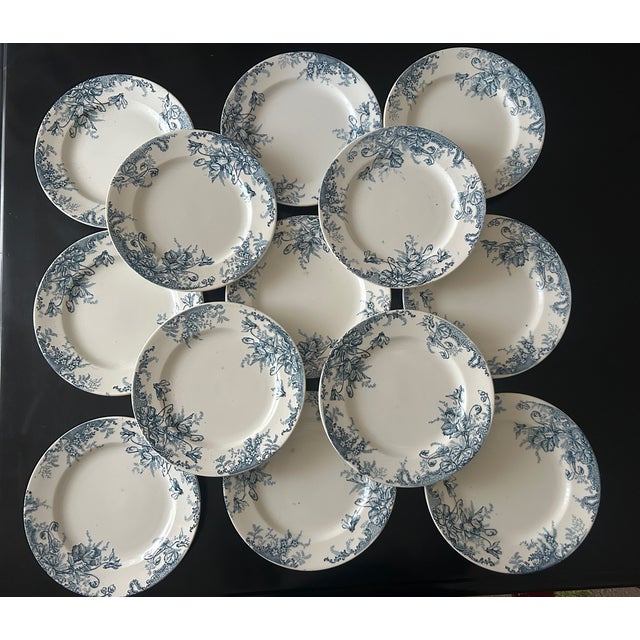 Rare set of 13 Terre de Fer plates, stamped Louis Graves (1894-1913) Cyclamen pattern This piece has an attribution mark,...