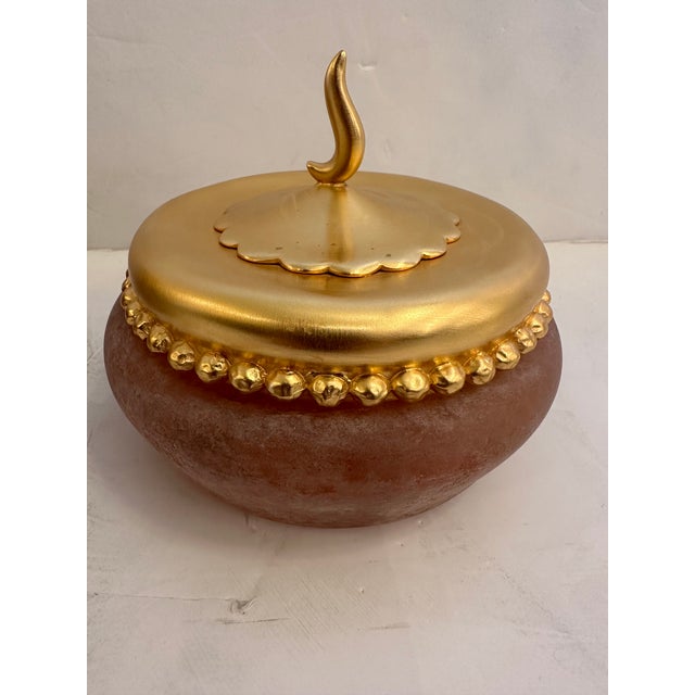 Pair of beautiful round studio art glass jars with gold leaf lids having imaginative design and form. Tall one 6.5” H x 5”...