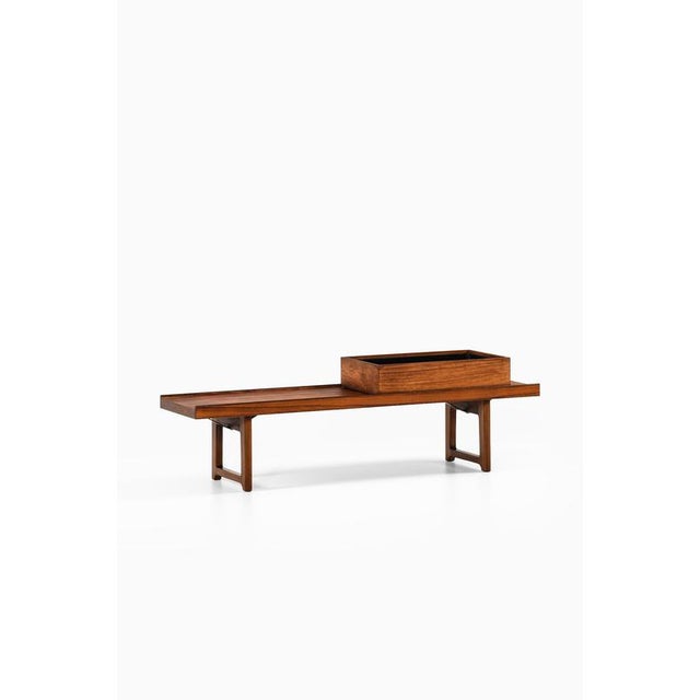 This bench or side table model krobo with a planter box, designed by torbjørn afdal and produced by bruksbo in norway, is...