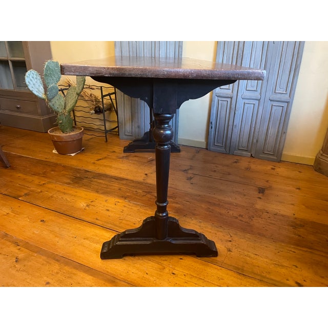 A beautiful, slightly longer French bistro table dating back to 1900. The top is made of oak. The attractive wooden base...