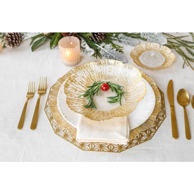 Glowing strands encircle the Rufolo Glass Gold Small Shallow Bowl. Care Instructions: Handwash