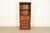A gorgeous Mid-Century Modern Hollywood Regency Campaign bookcase with drop front secretary desk In the manner of Henredon...