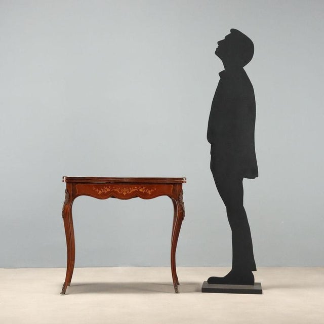 Mid-19th century English game table crafted from Indian rosewood and mahogany. The molded top features elegant maple...