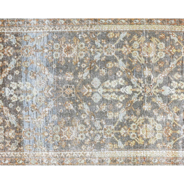 This semi Antique Persian Mahal Runner is expertly handwoven with wool-on-cotton, crafted from a luxurious blend of...