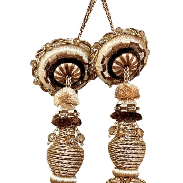 Pair of vintage French light bronze color beaded tassels. These have several strand of acrylic beads mixed in the tassel....