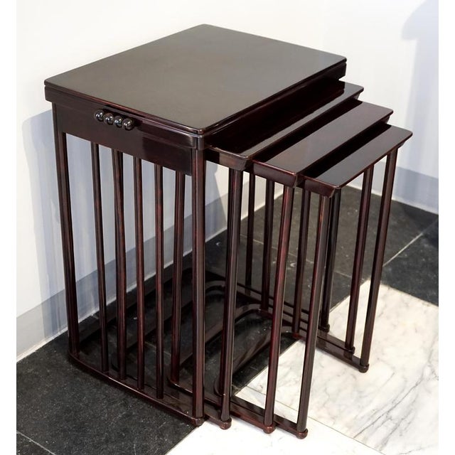 Elegant art nouveau side table set consisting of four individual tables of different sizes that can be nested inside each...