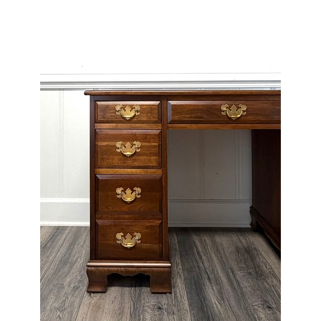 This is a Vintage Solid Cherry Pedestal Desk or also known as a Kneehole Desk or an Executive Desk. Made by the Maddox...