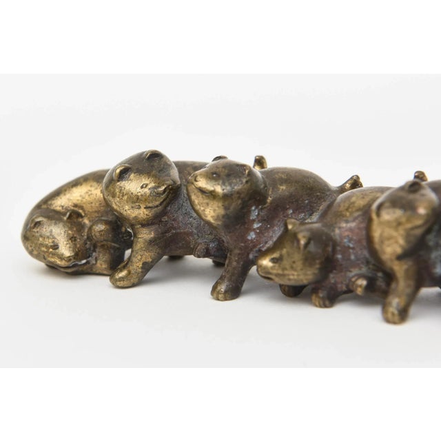 This most unusual signed rare vintage Arthur Court bronze paperweight is of dogs or puppies connected ands linked to each...
