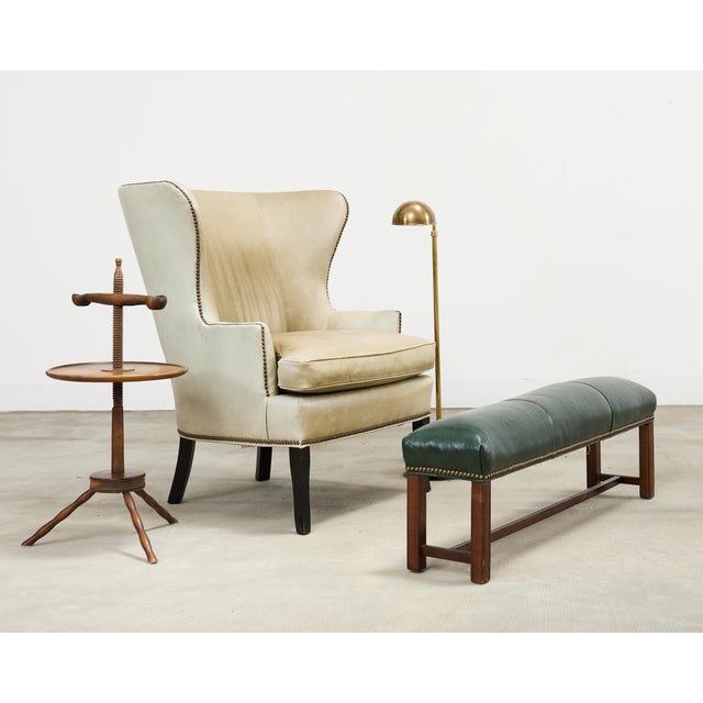 Handsome elongated mahogany footstool made in the George III taste. The footstool features a nearly 4 foot long mahogany...