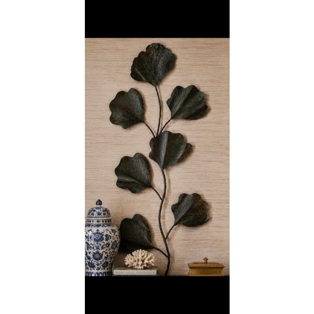 Elevate your interior with this striking oversized metal botanical wall sculpture featuring an elegant organic branch form...