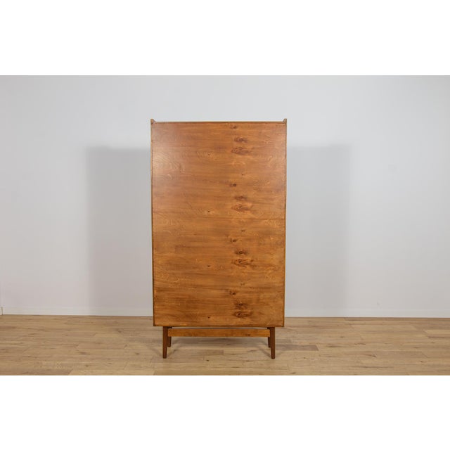This bookcase was designed by Johannes Sorth for the Danish furniture manufacturer Bornholms Møbelfabrik during the 1960s....