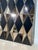 Striking large wall mirror composed of sculptural faceted mirror panels arranged in a geometric grid. Each mirrored...
