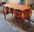 Make a bold statement with this large French Rococo-style executive desk, featuring a rich brown finish, elegant curved...
