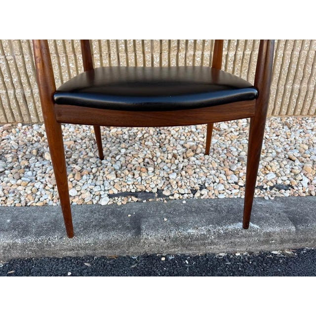 Mid Century " Model Casala" Teak Black Vinyl Armchair. Armchair in teak wood and black artificial leather. Sturdy and...